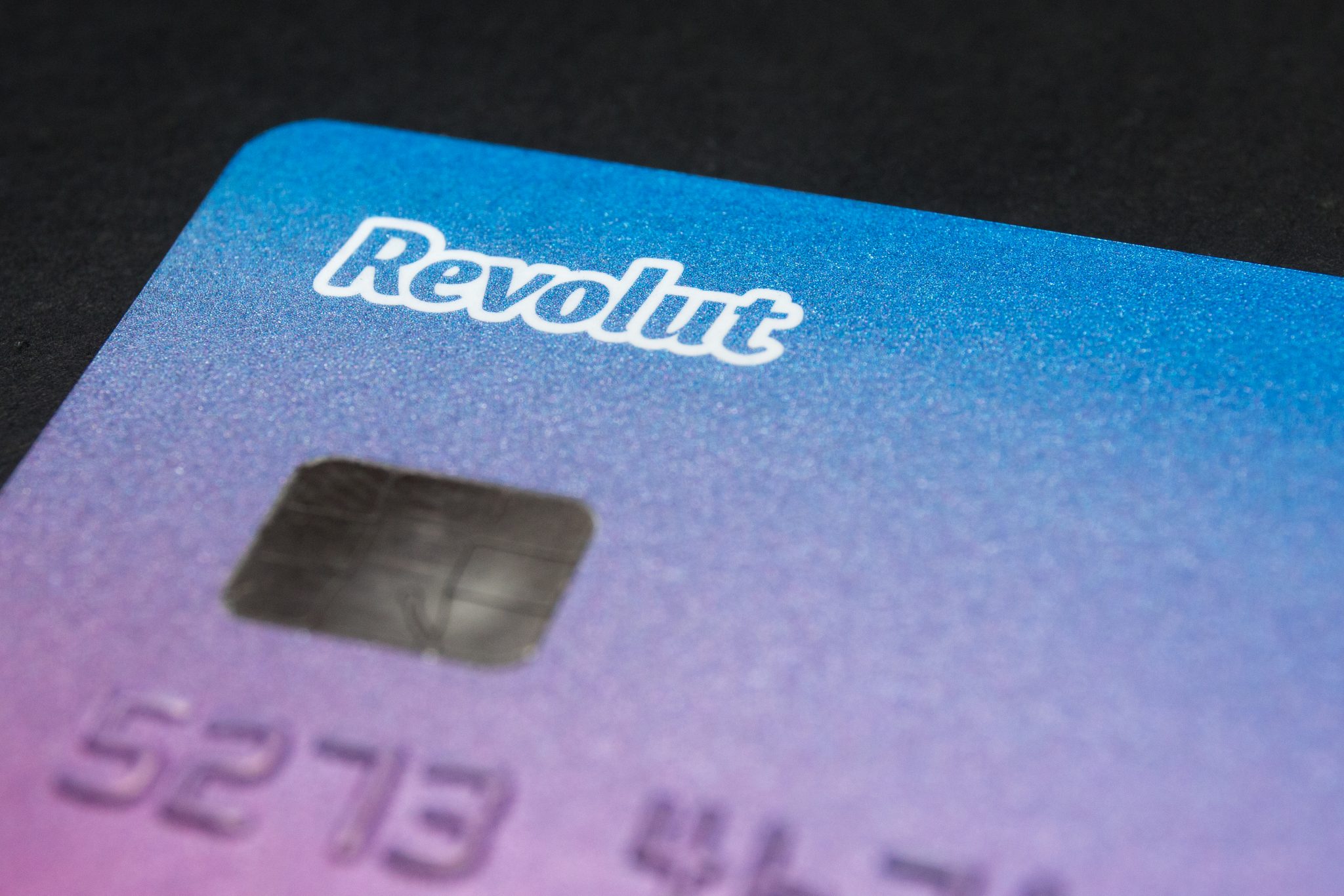 In this photo illustration a Revolut logo seen on a